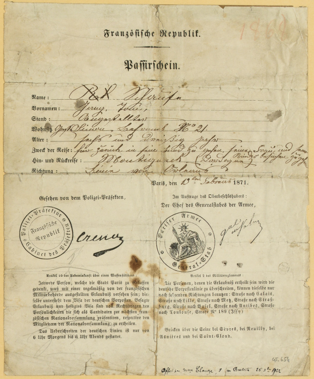 Gelbliches deutsches Regierungsdokument mit rundem schwarzumrandetem Stempel und schwarzer Tinte.